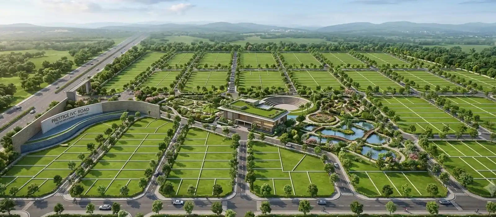 Wide internal road with street lighting and landscaped verges, representing layout infrastructure in a plotted development